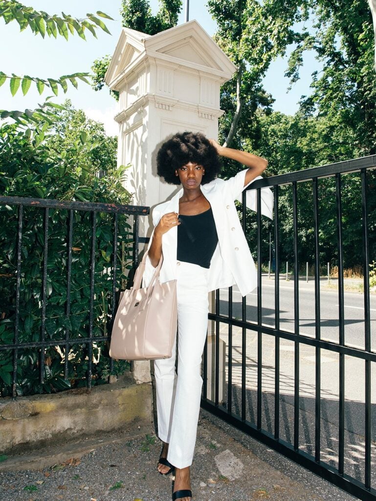 Melina Bucher Vegan Handbag on model outdoors with green background
