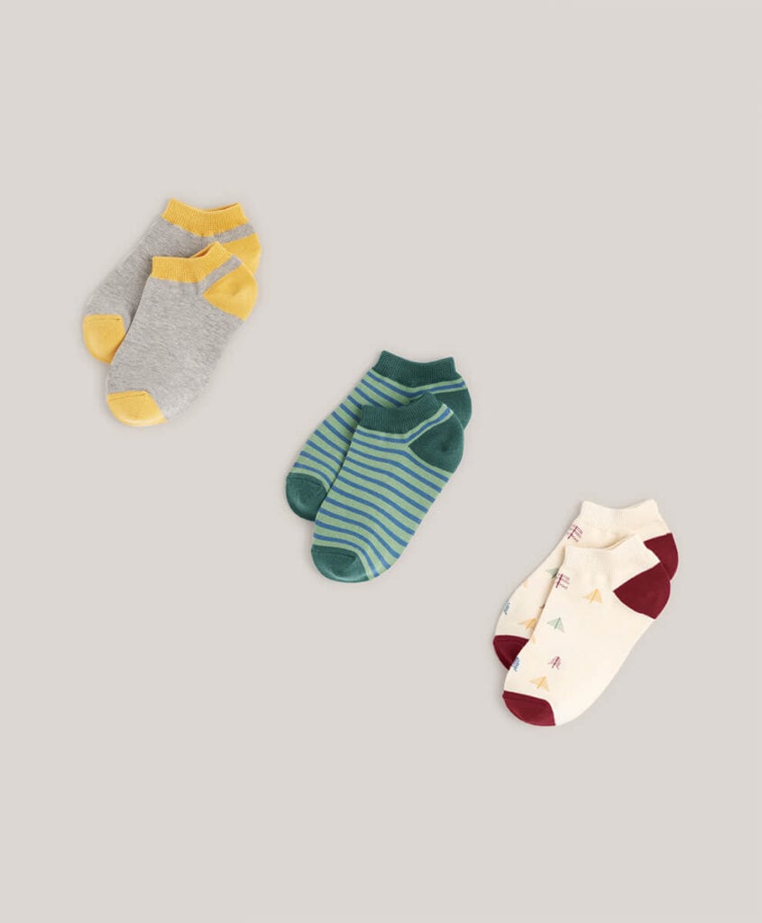 Pact Organic kids ankle socks in three patterns;  block color, stripe, and trees