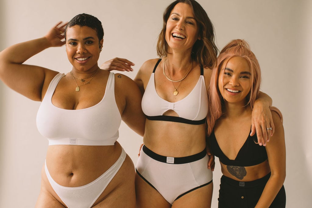 Group of three women all wearing Pantee bra and pant sets in white and black cotton