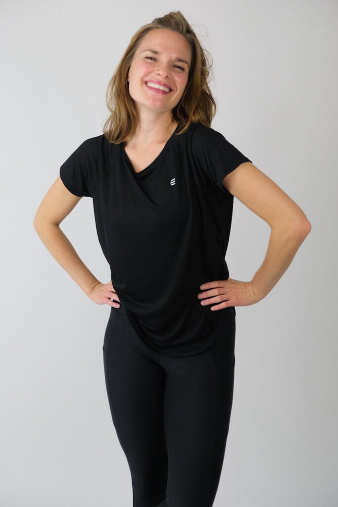 Tripulse sustainable activewear modeled by smiling woman